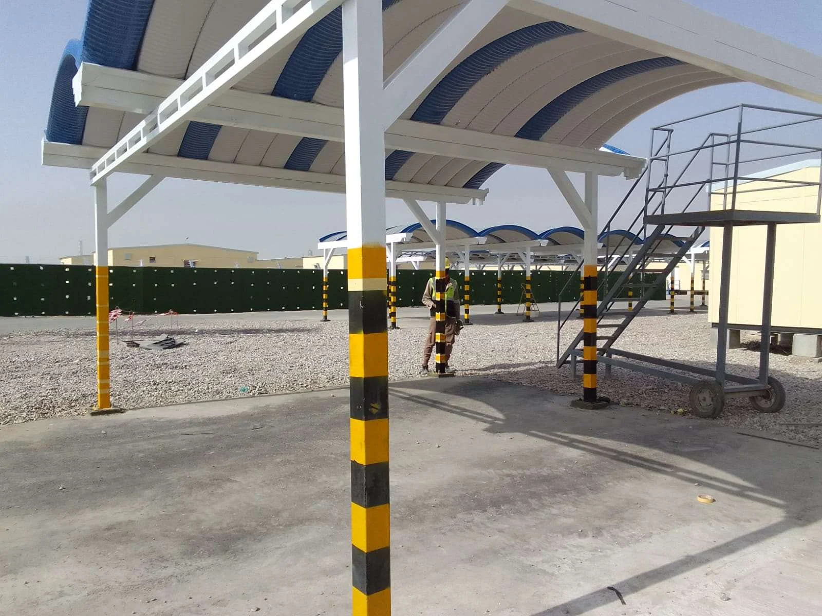 Parking canopy construction and steel columns.