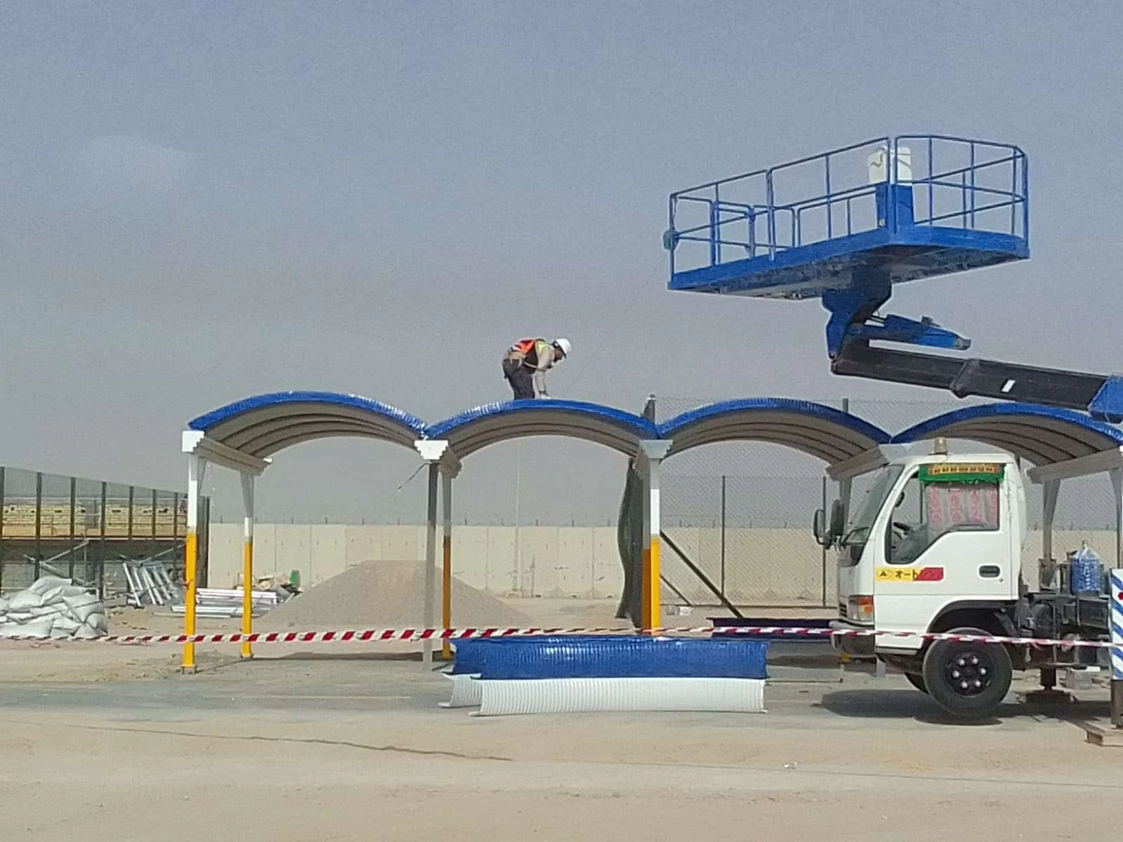 Roof installation using an aerial work platform.