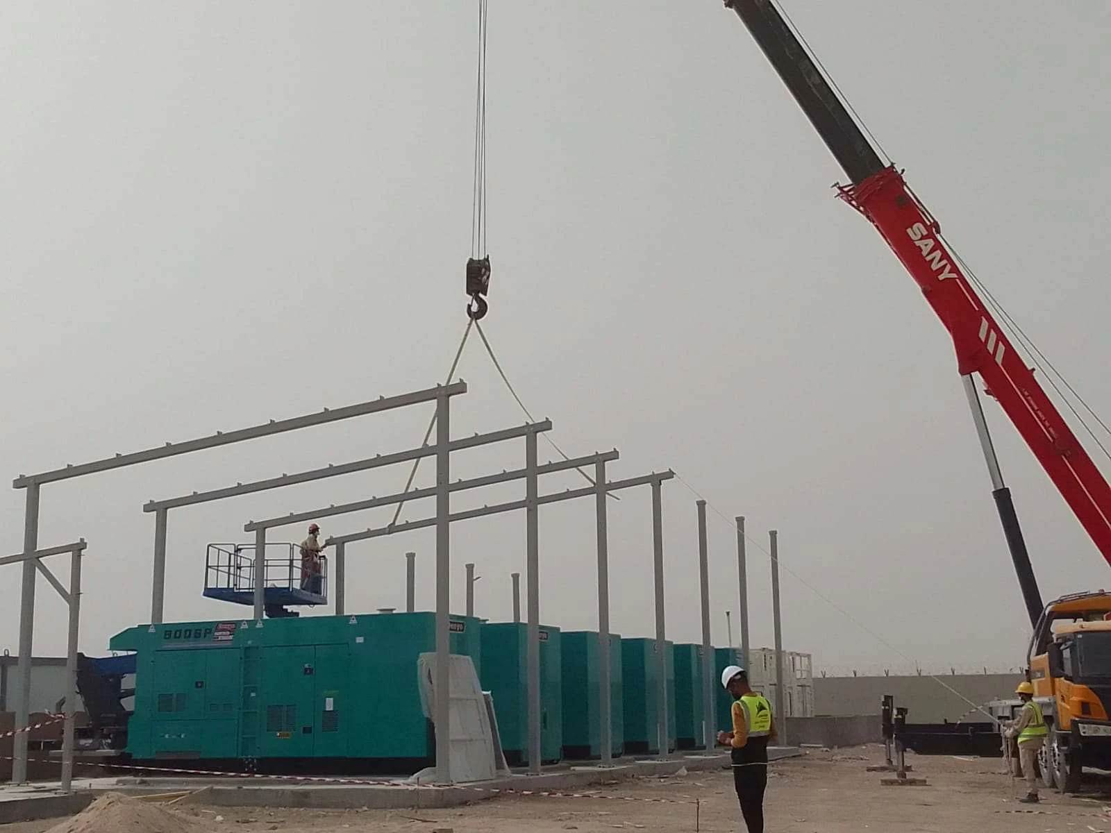 Crane-assisted steel lifting and erection.